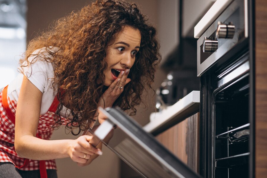 woman-baking-meal-oven_1303-22260